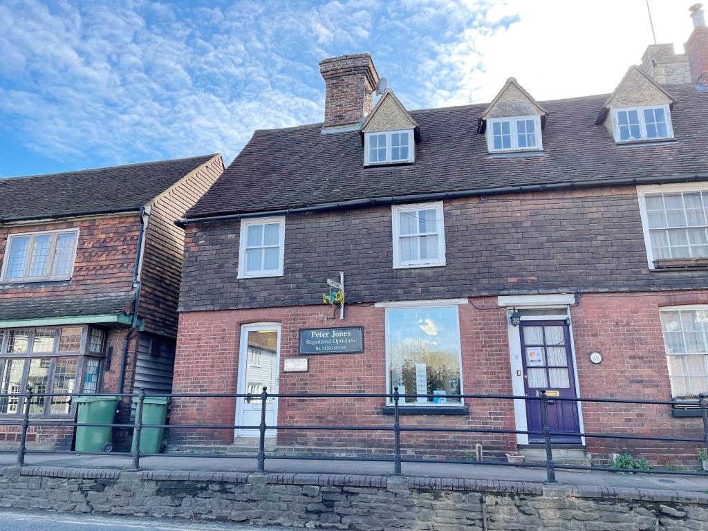 Lot: 35 - SHOP FOR INVESTMENT WITH PLANNING FOR CONVERSION OF UPPER PARTS TO ONE FLAT - Front of red brick property with shop on the ground floor and upper parts.